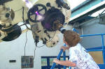 Mark at the Franklin Institute looking at the sun through a telescope.